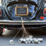 Vintage,Wedding,Car,With,Just,Married,Sign,And,Cans,Attached